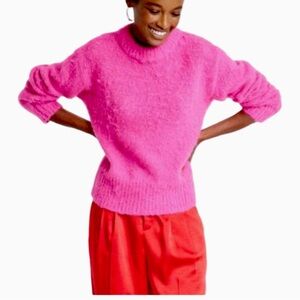 Soft fuzzy pink sweater by a new day.